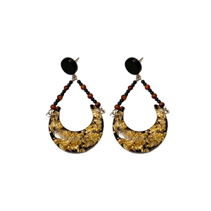 Vintage resin crescent earrings with gold foil accents and black bead connectors