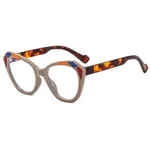 Cat eye blue light glasses with khaki frames and colorful geometric accents on white background