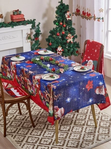 Detail of Christmas tablecloth and Santa chair covers in a festive holiday scene