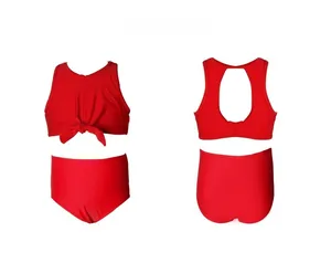Detail showing two-piece red girls' swimwear with front knot and stylish back cutout design