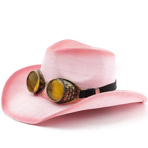 Pink woven western cowboy hat featuring steampunk goggles on a clean white background