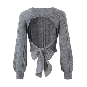 Grey backless knit sweater featuring cable knit sleeves and a large bow tie closure