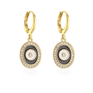 Close-up of gold-plated evil eye earrings with zircon stones and enamel detail