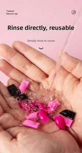 Washable silicone protective caps for dual-use nail tweezers shown under running water