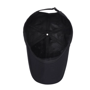 Internal structure of black baseball cap showing six-panel stitching and adjustable strap