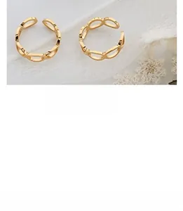 Detailed macro shot of hollow interlocking rings in gold-plated finish with adjustable band