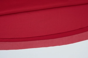 Close-up of red mesh hem and fabric texture on a slim fit bodycon maxi dress set