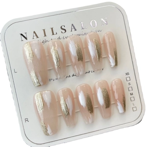 Handmade long trapezoid press-on nails with nude pink base and gold leaf paint design