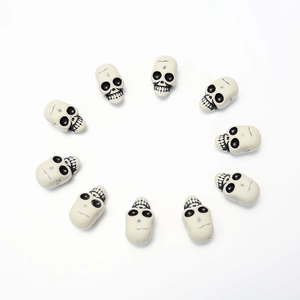 Set of 10 mini beige skull beads for Halloween DIY decor and skull themed jewelry making
