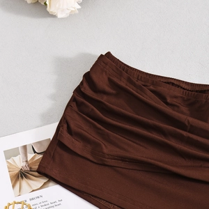 Detailed view of brown ruched fabric texture with stylish metal hardware accents