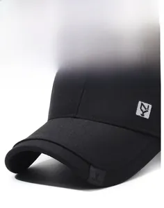 Macro view of structured brim and detailed embroidery on the black cotton baseball cap