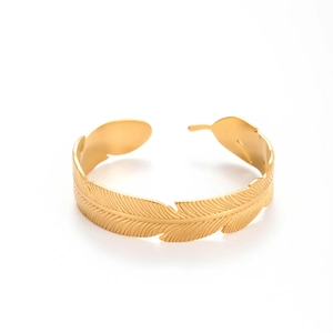 Adjustable wide feather cuff bracelet in gold stainless steel on a white background