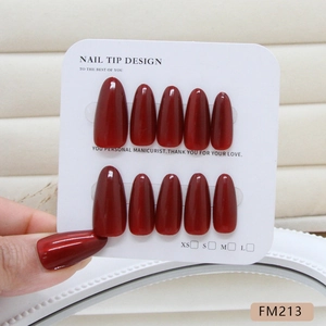 Handmade wine red cat-eye press-on nails in oval shape with high-gloss finish