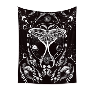 Close-up of bohemian lunar moth tapestry featuring mushrooms and celestial moon phases