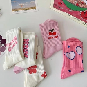 Pink and white cotton mid-calf socks with heart and flower patterns for women