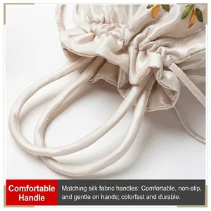Exquisite embroidered silk handbag with floral patterns and soft drawstring closure