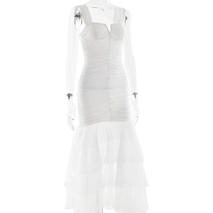 Close-up of white V-neck sleeveless dress featuring ruched bodice and mesh mermaid hem