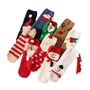 Thick warm coral fleece Christmas socks featuring festive Santa and reindeer patterns