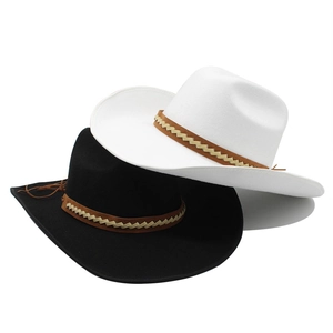 Detail of black and white wool felt cowboy hats with brown braided leather bands