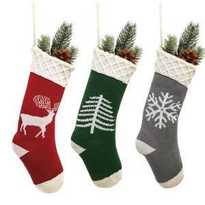 Three-piece set of knitted Christmas stockings with deer, snowflake, and tree patterns