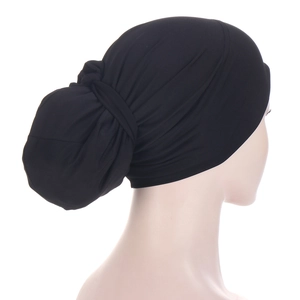 Detail of the back knot and pleats on a black turban headwear for women