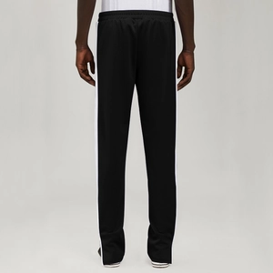 Rear view of men's casual track pants with side stripes and elastic waistband