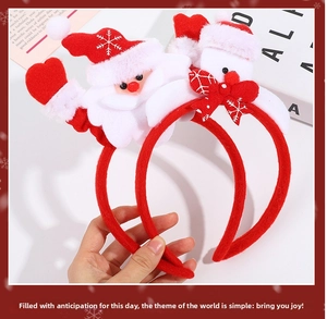 Close-up of two red Christmas headbands featuring 3D Santa Claus plush ornaments