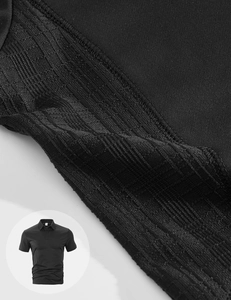 Close-up of premium black pique cotton fabric texture on a casual men's short sleeve polo shirt