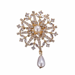 Golden snowflake brooch with central faux pearl and sparkling crystal accents for women