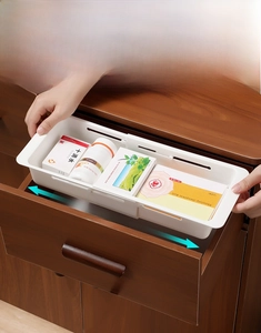 Adjustable white plastic divider for kitchen drawers and cabinet organization