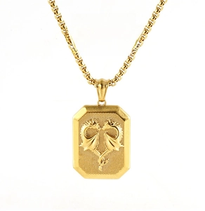 Detail of 3D embossed dragon heart square pendant on gold stainless steel chain