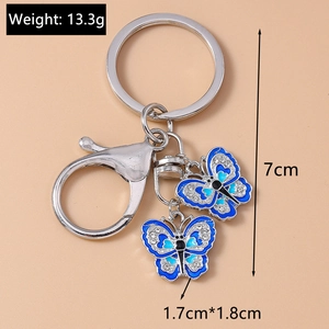 Detail showing blue butterfly keychain dimensions 7cm length and 13.3g weight
