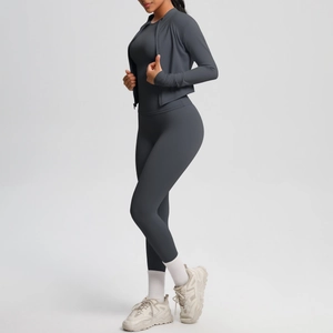 Three-piece dark grey slim fit yoga set featuring zip jacket and high-waisted leggings