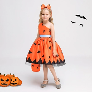 Detail of girls pumpkin dress with orange satin fabric and black mesh for Halloween