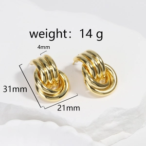 Detailed view showing dimensions and weight of gold layered hoop earrings on a stone base