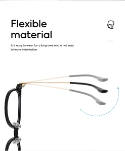 Close-up of flexible black and gold metal eyeglass temples showing high elasticity