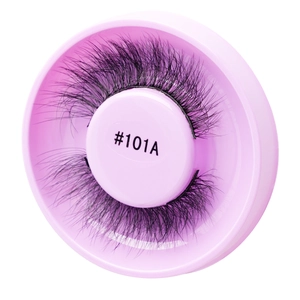 Detail view of dense black self-adhesive false eyelashes in a pink round storage box