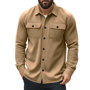 Detail view of khaki casual jacket showing front flap pockets and black buttons for men