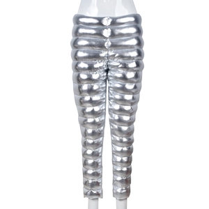 Detail of silver metallic quilted cotton pants with high-gloss finish and stitch texture