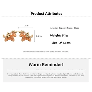 Detail view of 18k gold plated unicorn stud earring with orange zircon and dimensions