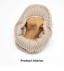 Close-up of winter knit hat showing thick oatmeal exterior and warm yellow fleece lining