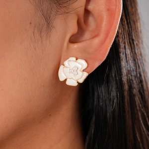 Vintage style floral resin stud earrings with white petals and small pearl center