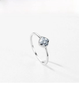 Detailed close-up of a square-cut cubic zirconia ring with a secure four-prong silver setting