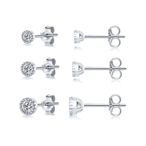 Macro detail of three pairs of S925 sterling silver stud earrings with clear zircon stones