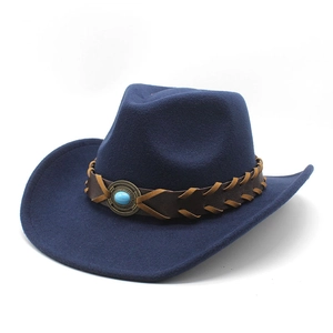Detail of dark blue felt cowboy hat with braided leather band and turquoise gemstone