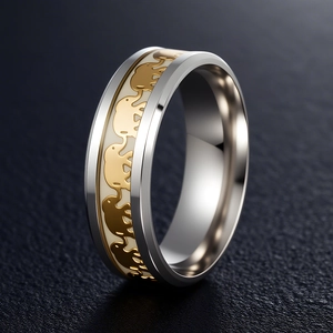 Luminous elephant ring in silver and gold two-tone finish on a dark textured background