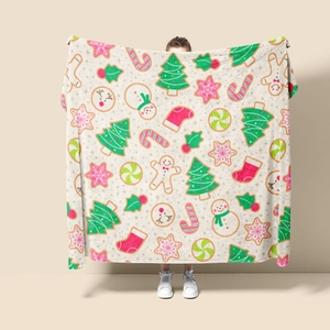 Detail of Christmas flannel blanket with gingerbread men and snowy trees print