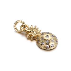 Macro detail of gold pineapple pendant with clear rhinestones and connector ring