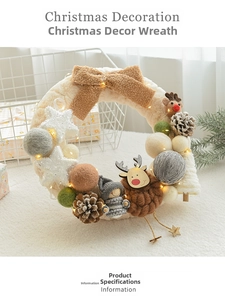 Detail of Christmas wreath with elk doll, wool felt balls, pine cones and warm LED lights