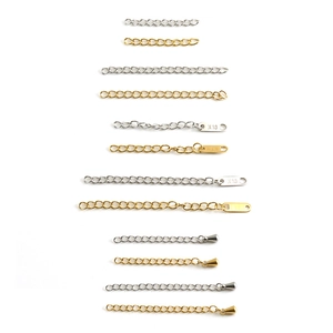 18k gold and silver stainless steel extender chains with X10 tags on white background